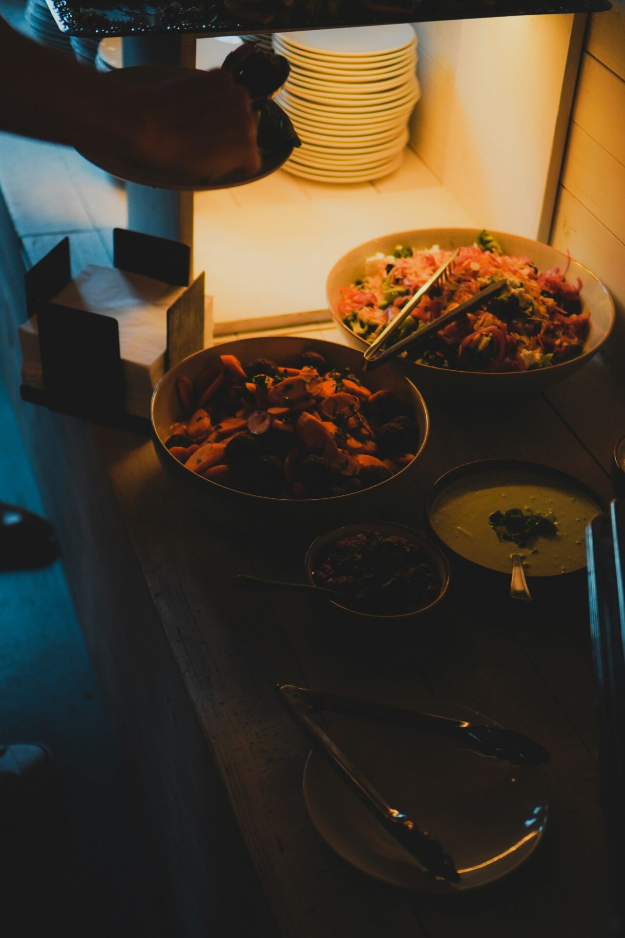 a table with plates and bowls of food on it